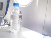 A bottle of water for drink on the aircraft