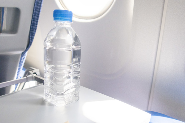 A bottle of water for drink on the aircraft